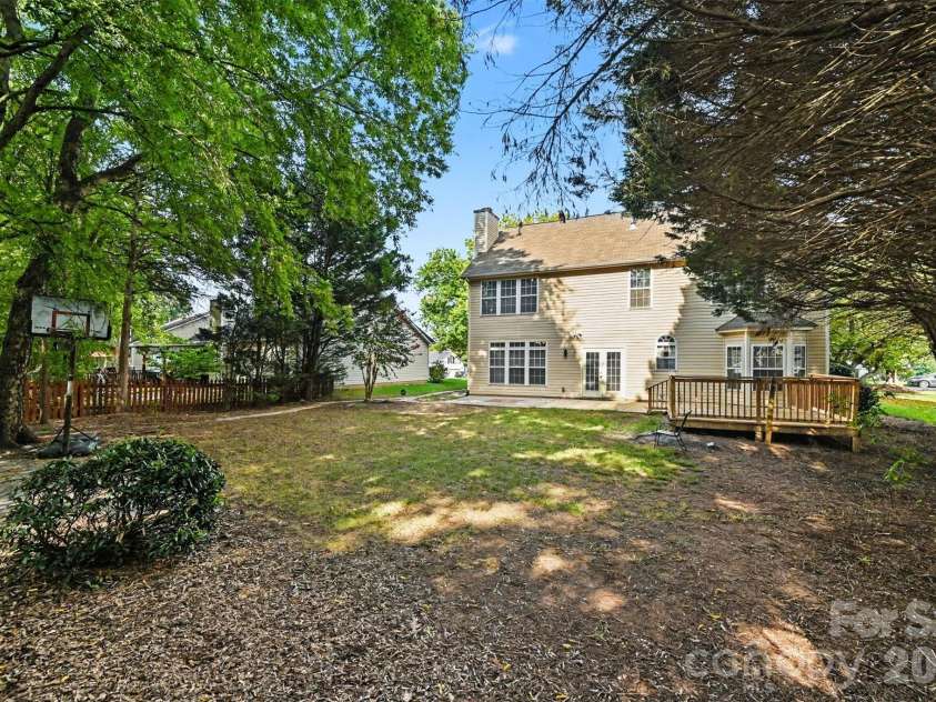 5839 BROOKSTONE Drive, Concord, NC 28027.  MLS# CAR4397657, YatesRealty ID 47457. Backyard view