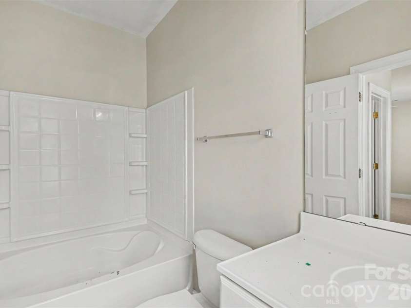 6858 Park Place Drive, Charlotte, NC 28262.  MLS# CAR4417425, YatesRealty ID 47473. Main Level Primary Bathroom