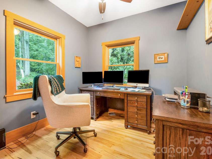 553 River Bend Drive, Mars Hill, NC 28754.  MLS# CAR4418089, YatesRealty ID 47487. Front room on the left serves as a nice office with forest views.