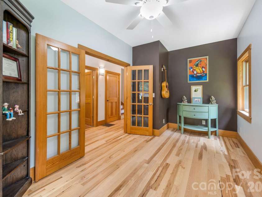 553 River Bend Drive, Mars Hill, NC 28754.  MLS# CAR4418089, YatesRealty ID 47487. Front room on the right is great for a cozy reading/music space.