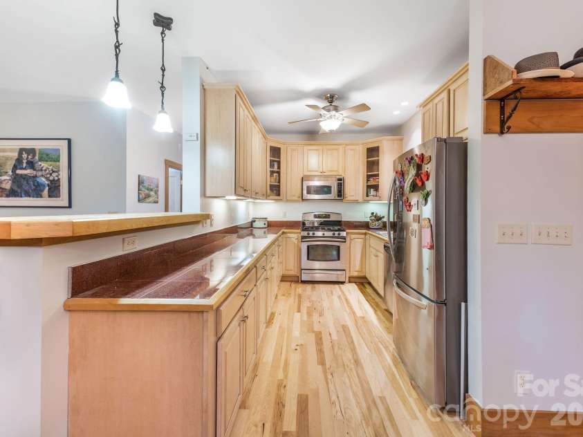553 River Bend Drive, Mars Hill, NC 28754.  MLS# CAR4418089, YatesRealty ID 47487. Open kitchen plenty of countertop space.
