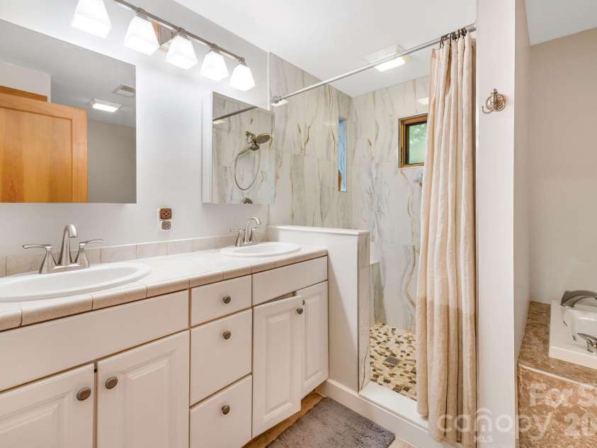 553 River Bend Drive, Mars Hill, NC 28754.  MLS# CAR4418089, YatesRealty ID 47487. Primary suite with dual sinks.