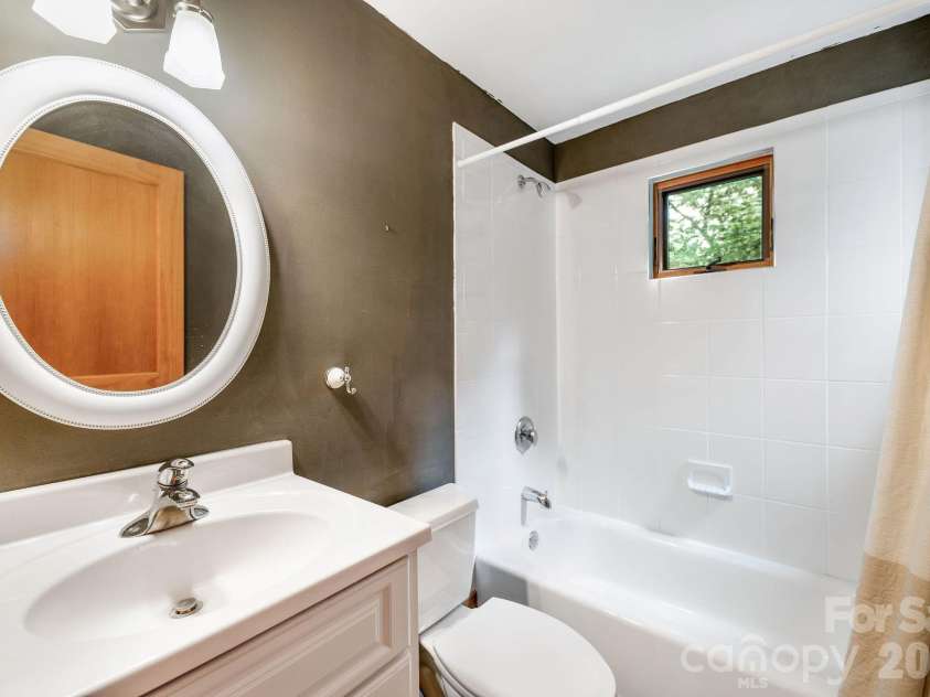553 River Bend Drive, Mars Hill, NC 28754.  MLS# CAR4418089, YatesRealty ID 47487. Second upstairs bathroom is spacious with bathtub.