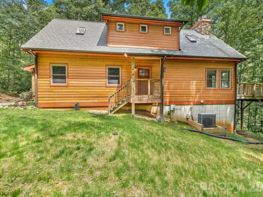 553 River Bend Drive, Mars Hill, NC 28754.  MLS# CAR4418089, YatesRealty ID 47487. Southside of house opens onto a recently hydro seeded yard.