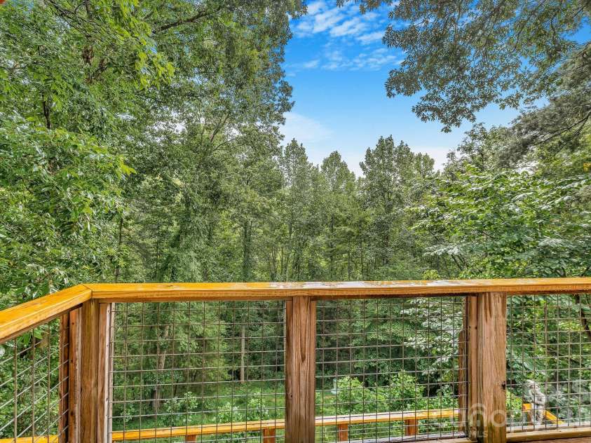 553 River Bend Drive, Mars Hill, NC 28754.  MLS# CAR4418089, YatesRealty ID 47487. Spectacular forest and sky views from the primary suite deck