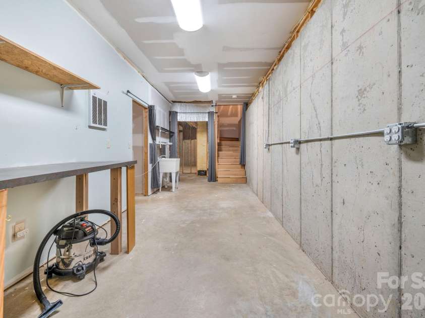553 River Bend Drive, Mars Hill, NC 28754.  MLS# CAR4418089, YatesRealty ID 47487. Workshop space in basement.