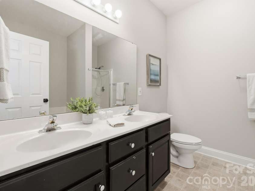 21246 Hickory Street, Cornelius, NC 28031.  MLS# CAR4417839, YatesRealty ID 47488. Dula vanities in primary bath