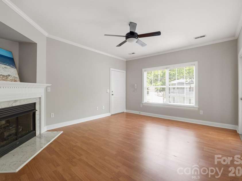 21246 Hickory Street, Cornelius, NC 28031.  MLS# CAR4417839, YatesRealty ID 47488. Great room fills with light from large windows
