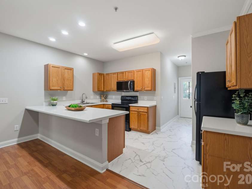 21246 Hickory Street, Cornelius, NC 28031.  MLS# CAR4417839, YatesRealty ID 47488. New counters and flooring in kitchen