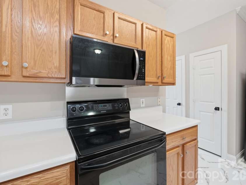 21246 Hickory Street, Cornelius, NC 28031.  MLS# CAR4417839, YatesRealty ID 47488. New microwave stainless and smooth cooktop oven