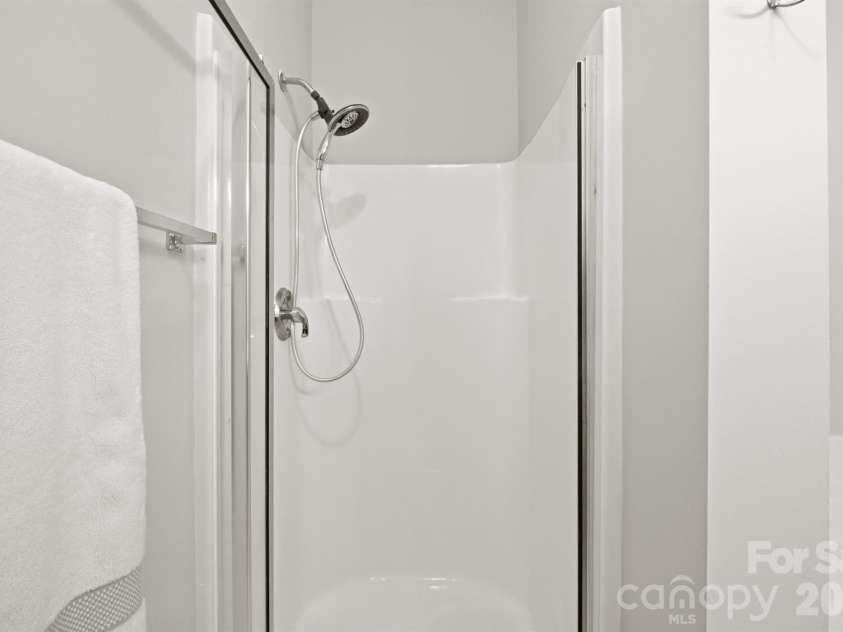 21246 Hickory Street, Cornelius, NC 28031.  MLS# CAR4417839, YatesRealty ID 47488. Shower in primary bath
