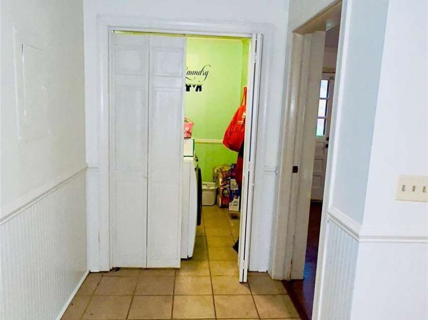 124 Riley Road, Dallas, NC 28034.  MLS# CAR4244655, YatesRealty ID 4753. Laundry room off of kitchen with shelving