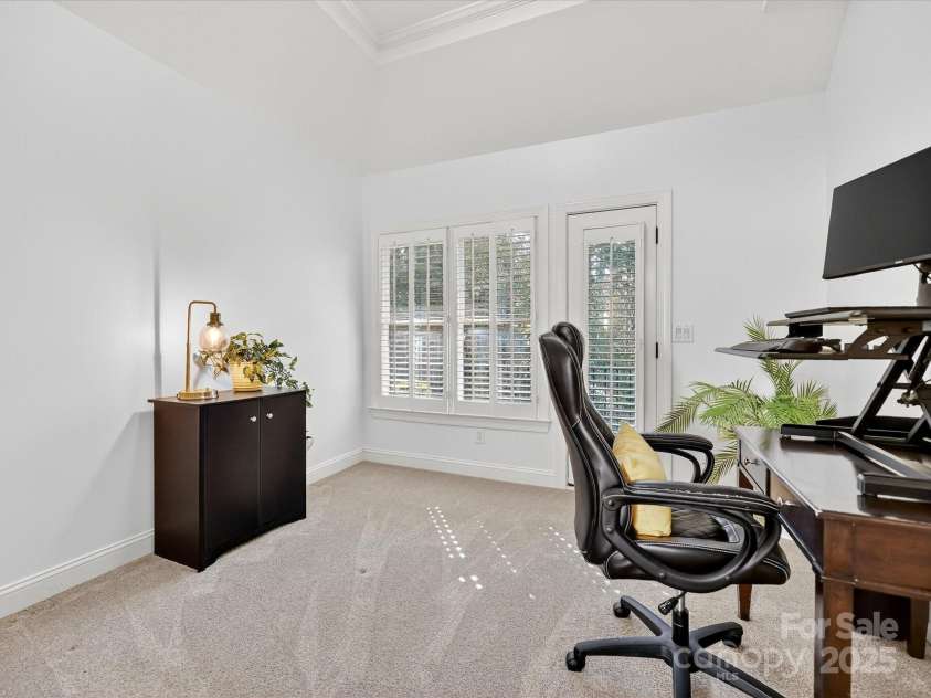 16128 Bridgehampton Club Drive, Charlotte, NC 28277.  MLS# CAR4308778, YatesRealty ID 4753. Office off of primary bedroom with balcony overlooking private backyard.