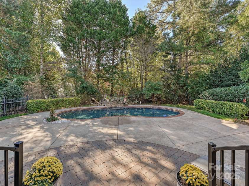 16128 Bridgehampton Club Drive, Charlotte, NC 28277.  MLS# CAR4308778, YatesRealty ID 4753. Salt water pool with fountain.