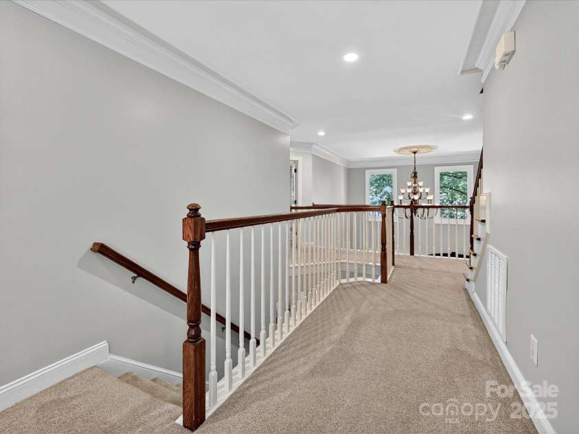 16128 Bridgehampton Club Drive, Charlotte, NC 28277.  MLS# CAR4308778, YatesRealty ID 4753. Second floor hallway. Open to foyer