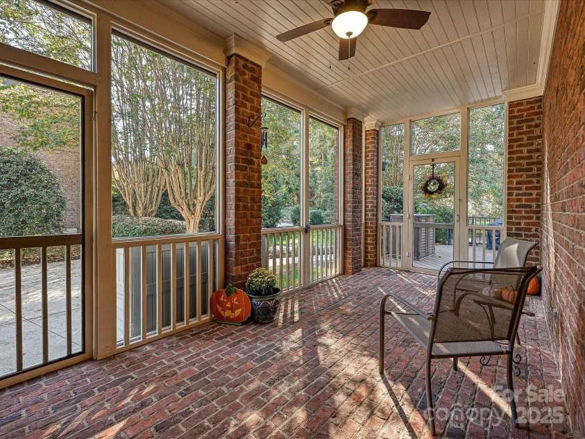 16128 Bridgehampton Club Drive, Charlotte, NC 28277.  MLS# CAR4308778, YatesRealty ID 4753. Side full brick screen porch with access to great room and backyard. 