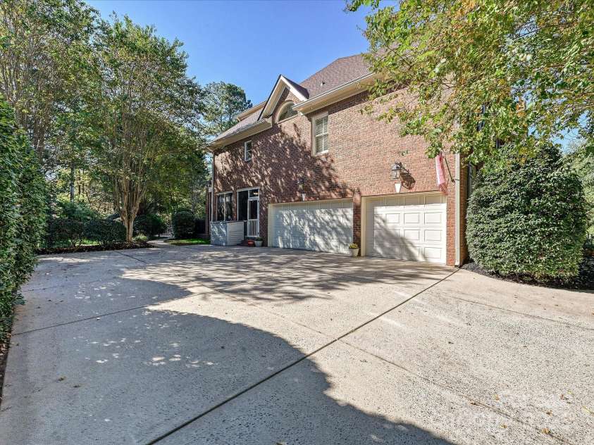 16128 Bridgehampton Club Drive, Charlotte, NC 28277.  MLS# CAR4308778, YatesRealty ID 4753. Three car garage with large driveway