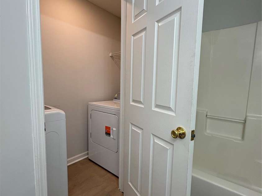 11586 Briddle Hall Court, Charlotte, NC 28214.  MLS# CAR4419064, YatesRealty ID 47547. Laundry room inside primary bathroom