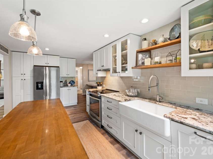 5934 Tillery Drive, Charlotte, NC 28226.  MLS# CAR4417835, YatesRealty ID 47561. Floating shelves in kitchen