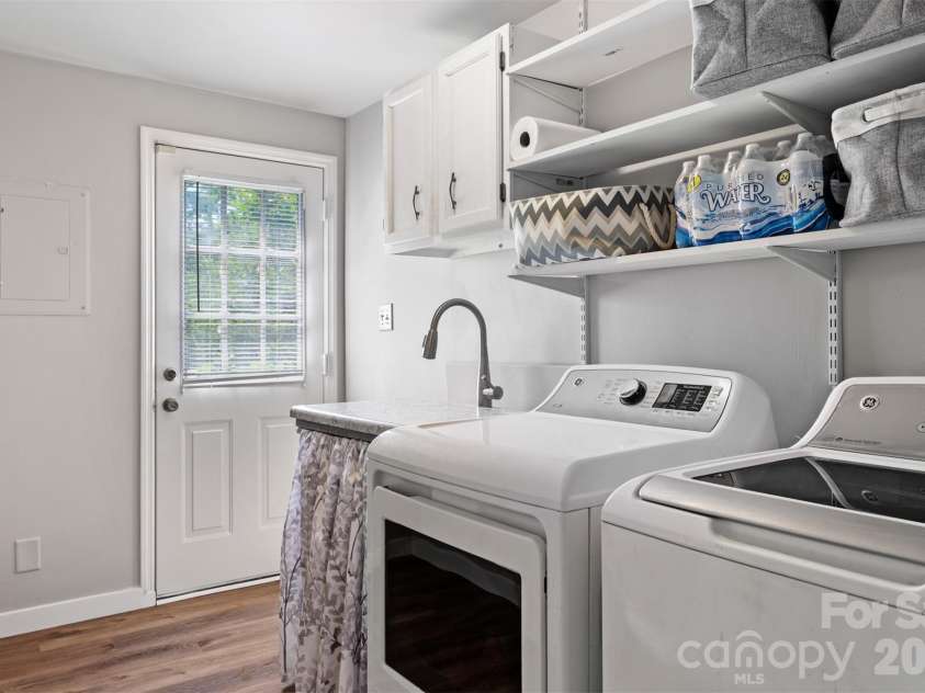 5934 Tillery Drive, Charlotte, NC 28226.  MLS# CAR4417835, YatesRealty ID 47561. Large laundry room w access to back yard