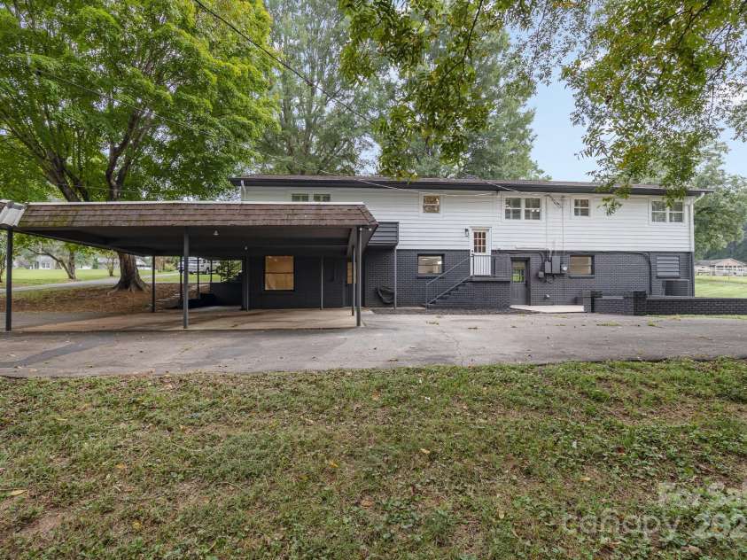 7407 Forney Hill Road, Denver, NC 28037.  MLS# CAR4222546, YatesRealty ID 4757. Back of Home / Carport