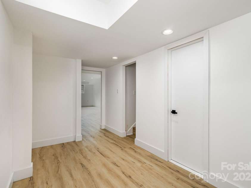 7407 Forney Hill Road, Denver, NC 28037.  MLS# CAR4222546, YatesRealty ID 4757. Downstairs hall and staircase