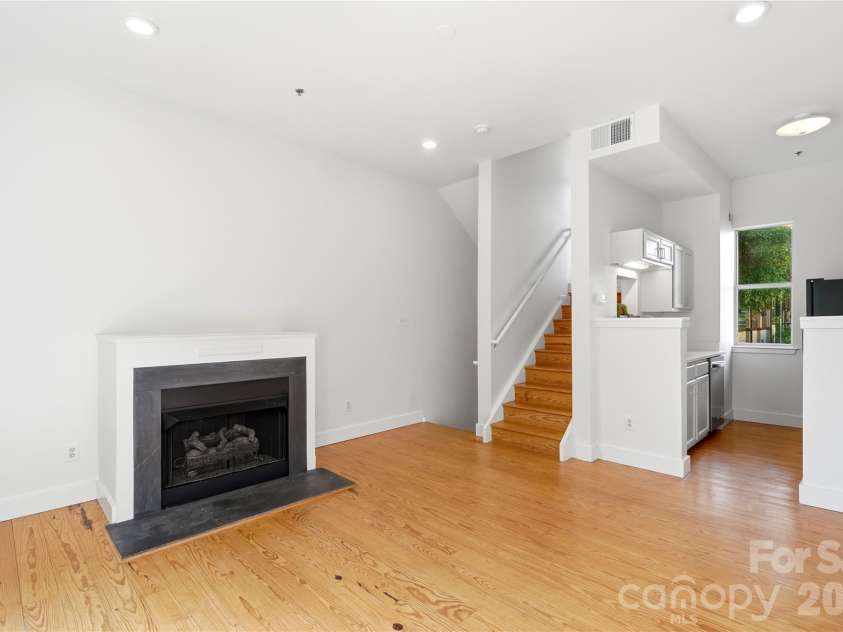 2090 Atherton Heights Lane, Charlotte, NC 28203.  MLS# CAR4419169, YatesRealty ID 47599. Inviting living area featuring a fireplace