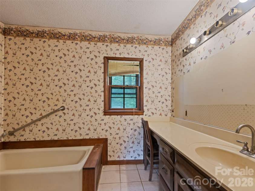 831 Qualla Road, Waynesville, NC 28785.  MLS# CAR4419397, YatesRealty ID 47602. 