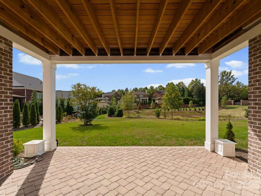 3011 Ella Katherine Way, Charlotte, NC 28210.  MLS# CAR4312353, YatesRealty ID 4763. Walk out from the basement to the covered porch area. 