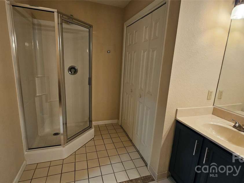 153 Ewbank Garden Drive, Hendersonville, NC 28791.  MLS# CAR4228838, YatesRealty ID 4764. Shower in Primary BA