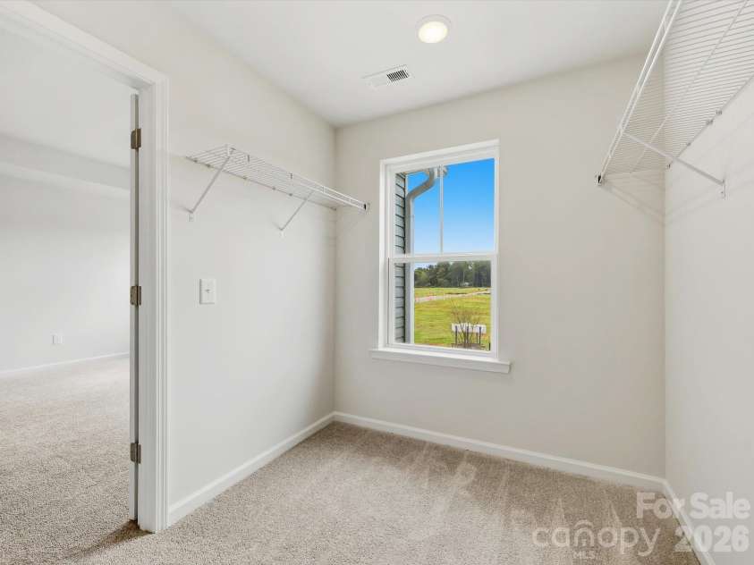 6609 Fire Lily Lane, Charlotte, NC 28216.  MLS# CAR4419428, YatesRealty ID 47646. Large Closet with Window