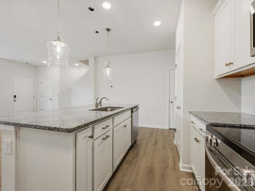6609 Fire Lily Lane, Charlotte, NC 28216.  MLS# CAR4419428, YatesRealty ID 47646. Large Island Centering the Kitchen