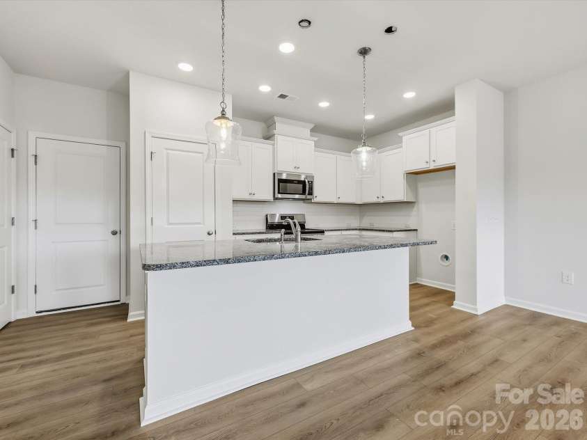 6609 Fire Lily Lane, Charlotte, NC 28216.  MLS# CAR4419428, YatesRealty ID 47646. Large Kitchen with Large Island