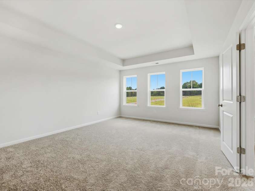 6609 Fire Lily Lane, Charlotte, NC 28216.  MLS# CAR4419428, YatesRealty ID 47646. Oversized Owner's Suite with Tray Ceiling on 2nd Floor