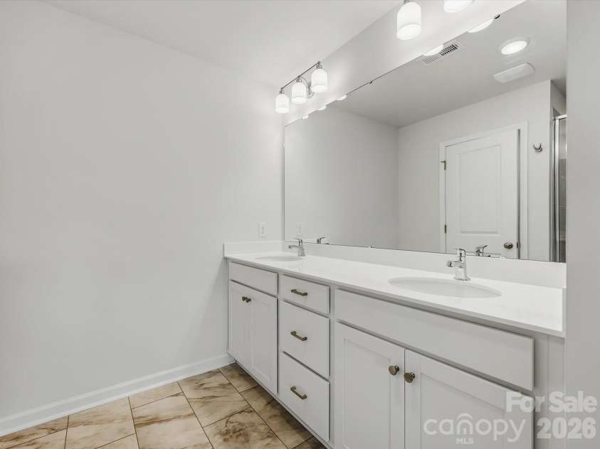 6609 Fire Lily Lane, Charlotte, NC 28216.  MLS# CAR4419428, YatesRealty ID 47646. Owner's Bathroom Offering a Double Vanity