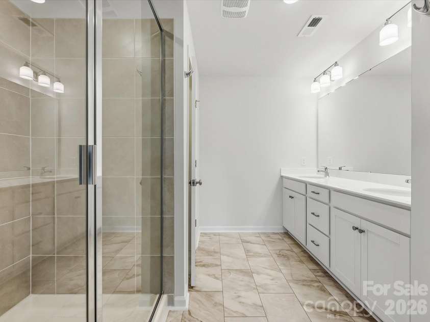 6609 Fire Lily Lane, Charlotte, NC 28216.  MLS# CAR4419428, YatesRealty ID 47646. Owner's Bathroom Offering a Large Shower and  Double Vanity
