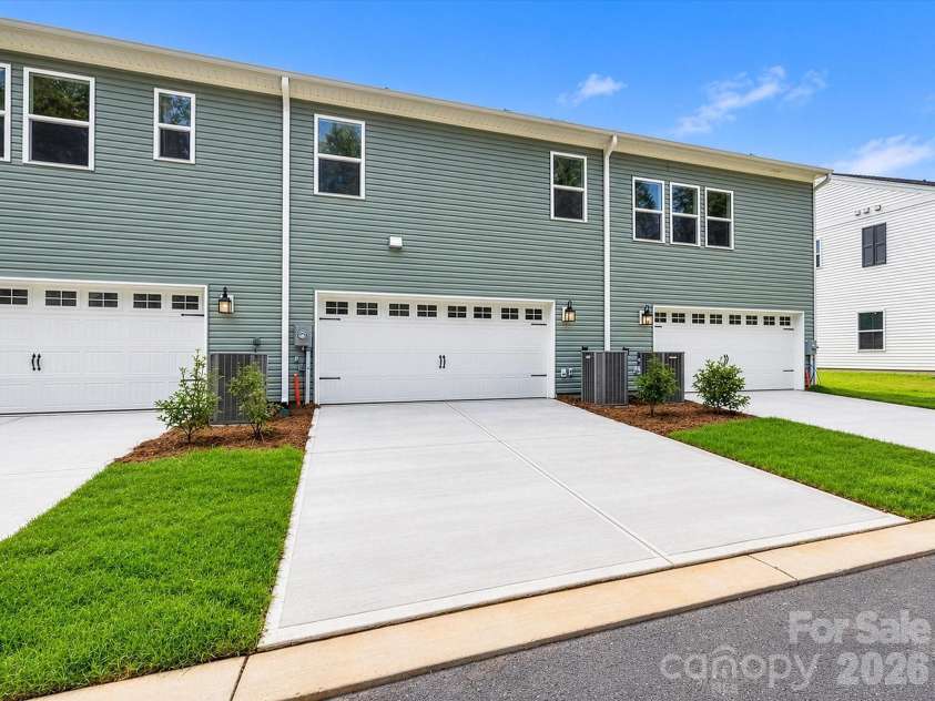 6609 Fire Lily Lane, Charlotte, NC 28216.  MLS# CAR4419428, YatesRealty ID 47646. Rear 2 car side-by-side Garage and a 20 ft Driveway for 4 Parking Spots