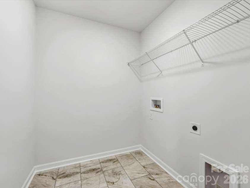 6609 Fire Lily Lane, Charlotte, NC 28216.  MLS# CAR4419428, YatesRealty ID 47646. Spacious Laundry Room with Linen Closet