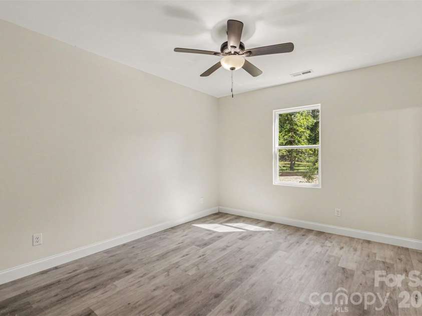2005 Overhill Drive, Monroe, NC 28110.  MLS# CAR4416161, YatesRealty ID 47661. Primary Bedroom on First Floor