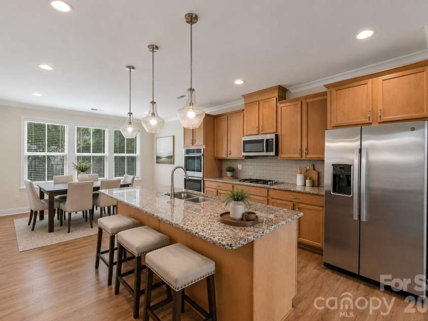 13116 Simoneaux Lane, Charlotte, NC 28277.  MLS# CAR4413421, YatesRealty ID 47662. Virtually Staged - Kitchen & dining areas