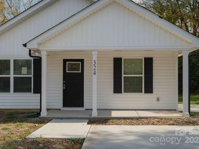 324 Ashford Street, Chester, SC 29706.  MLS# CAR4319489, YatesRealty ID 4768. Charming new construction with covered front porch and fresh curb appeal — move-in ready in a great Carolina neighborhood.