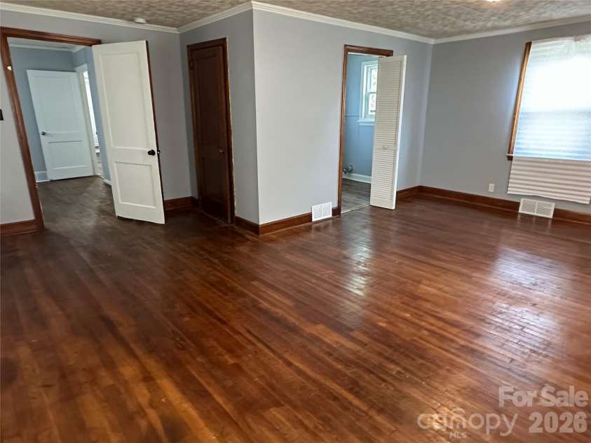 1012 Louise Road, Winston Salem, NC 27107.  MLS# CAR4419508, YatesRealty ID 47691. Primary den with half bath/laundry
