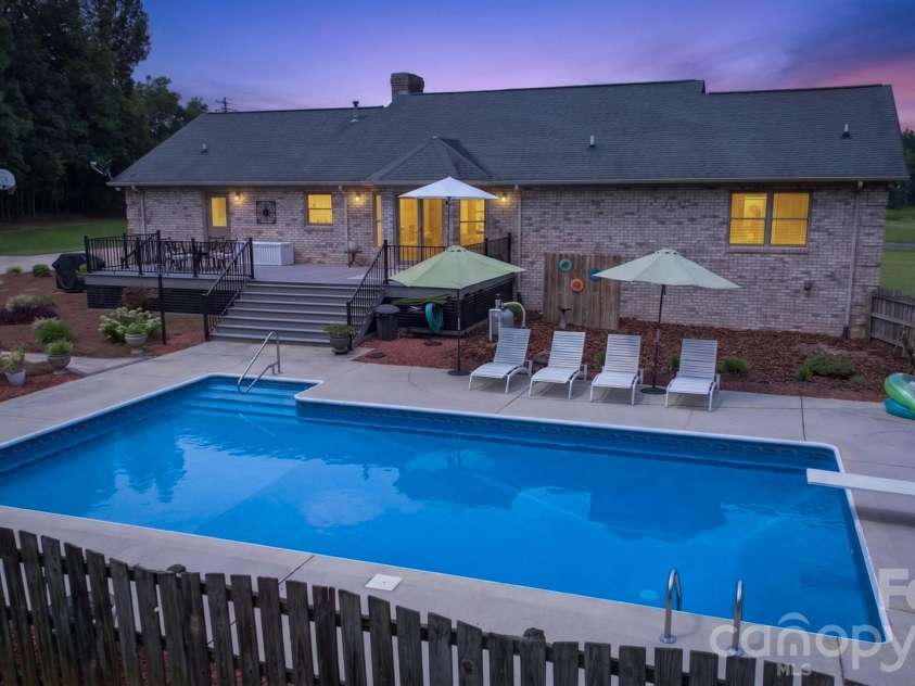 525 Gin Road, Rockwell, NC 28138.  MLS# CAR4419585, YatesRealty ID 47714. Pool / Twilight