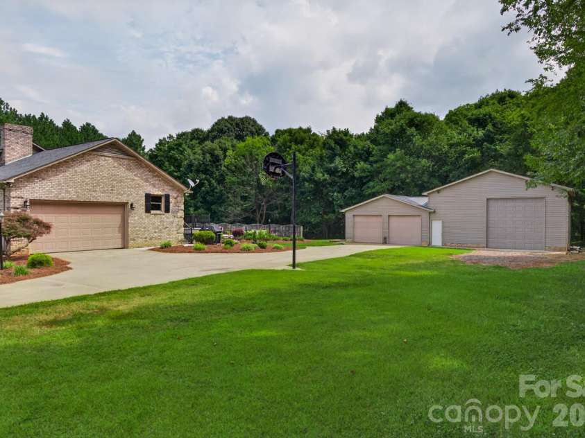 525 Gin Road, Rockwell, NC 28138.  MLS# CAR4419585, YatesRealty ID 47714. Right Side Yard