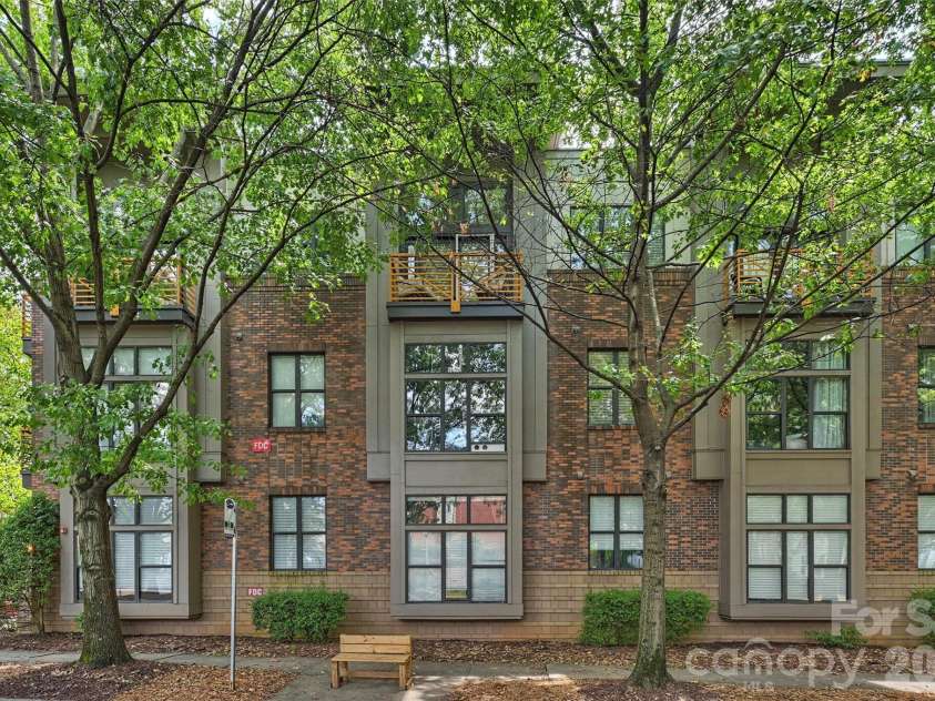 694 Davidson Street, Charlotte, NC 28202.  MLS# CAR4418966, YatesRealty ID 47716. Cityview Lofts Front Exterior