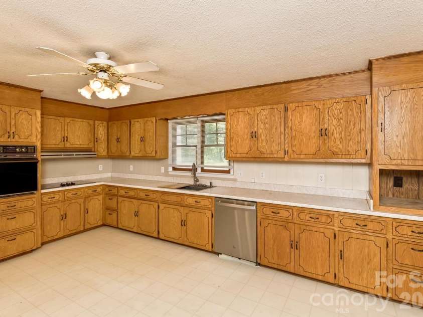 94 Stone Drive, Marion, NC 28752.  MLS# CAR4419587, YatesRealty ID 47719. Kitchen w/eat in area