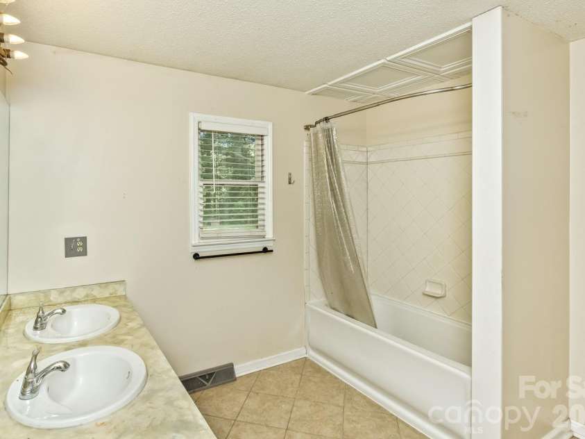 94 Stone Drive, Marion, NC 28752.  MLS# CAR4419587, YatesRealty ID 47719. Main Level Bathroom