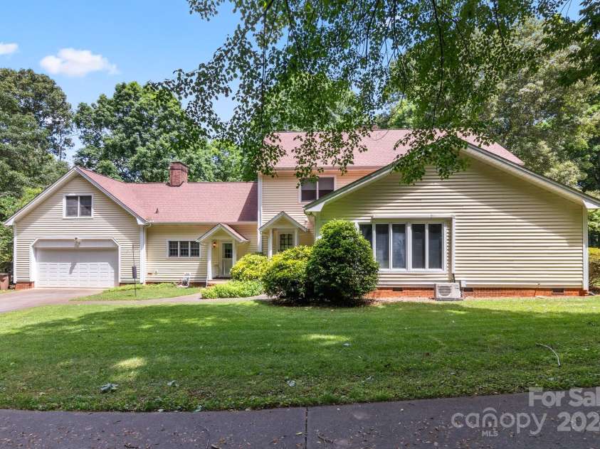 205 Vauxhall Drive, Shelby, NC 28150.  MLS# CAR4131707, YatesRealty ID 4772. Back exterior showing 2-car garage and 2 additional exterior entrances