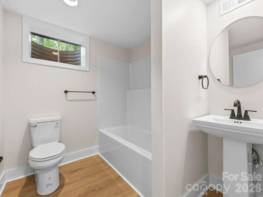 340 School Road, Asheville, NC 28806.  MLS# CAR4418622, YatesRealty ID 47721. Lower Level Bathroom