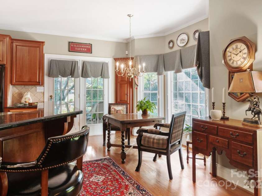 1408 Stone Gate Drive, Shelby, NC 28150.  MLS# CAR4181748, YatesRealty ID 4774. The breakfast area is surrounded by huge windows and has a door leading to the screened porch.